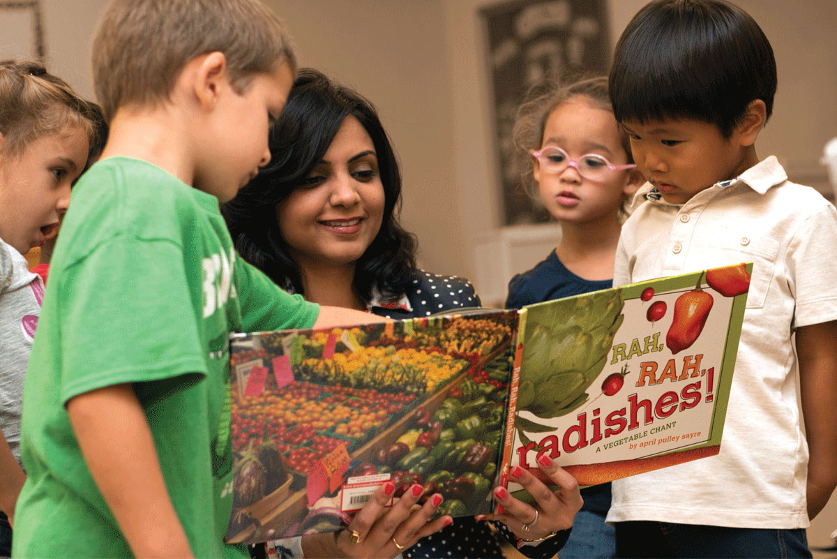 Vegetable story book being read to toddlers.