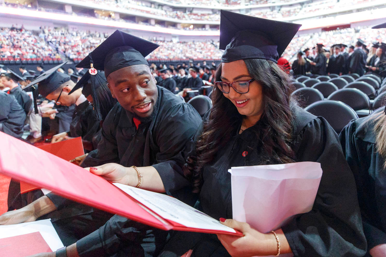 Students laughing at commencement