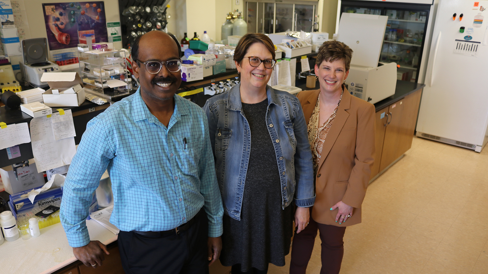 Sathish Kumar Natarajan, Jennifer Wood and Amanda Ramer-Tait pose for a photo in Sathish's research lab