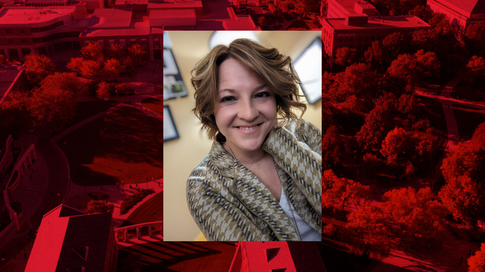 Professional headshot of Erin Pearson on a red background.