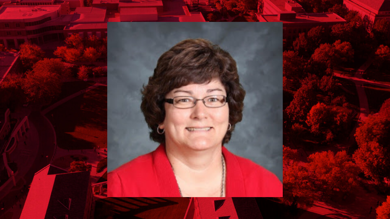 Professional headshot of Patricia Hinkle placed on a red background