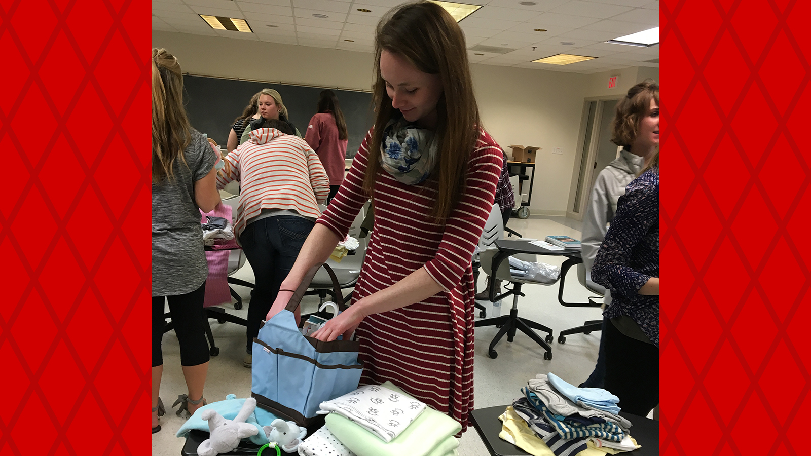 UNL NSSLHA members help put together baby bags for the Down Syndrome Association for Families (DSAF).
