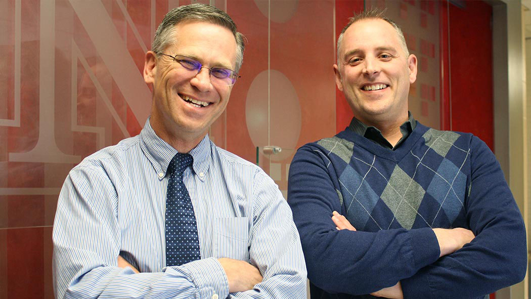 Richard Bischoff, chair of child, youth and family studies (left) and Paul Springer, associate professor, are partnering with international colleagues to apply their mental health model overseas. The model was developed in rural Nebraska communities.
