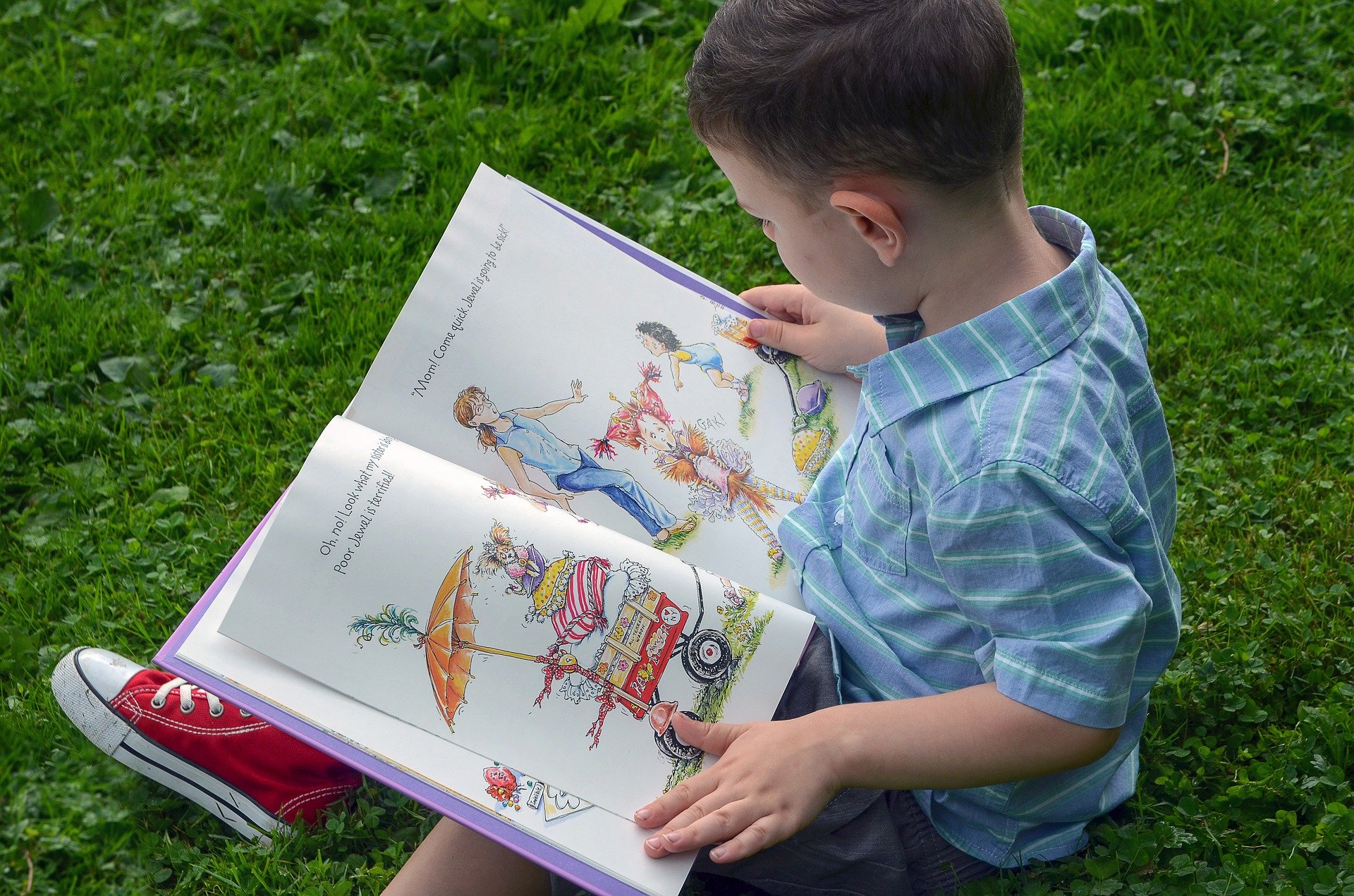 Child reading a story book.