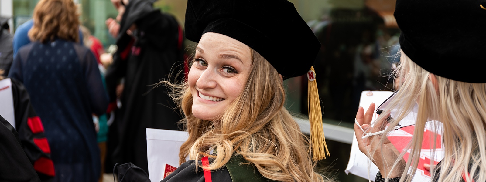 Laura Muller smiles after graduating from the Nebraska AuD program