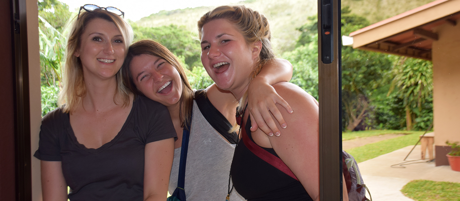 three Husker students share a laugh in Costa Rica