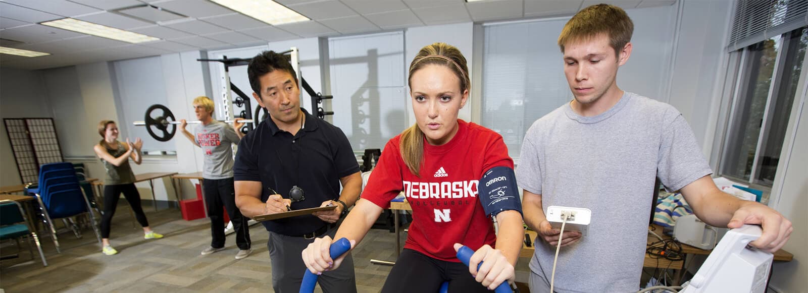 Student in testing lab with faculty watching