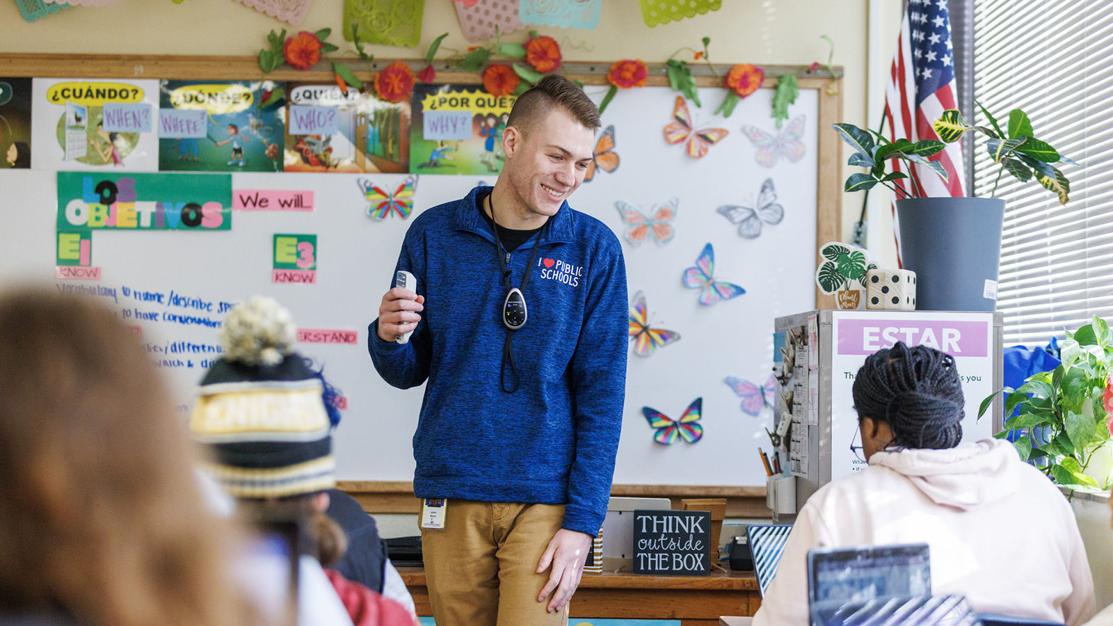 Teacher Standing in Classroom