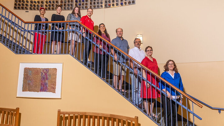 NOYCE Grant team members lined up on the stairs in Teachers College Hall. 