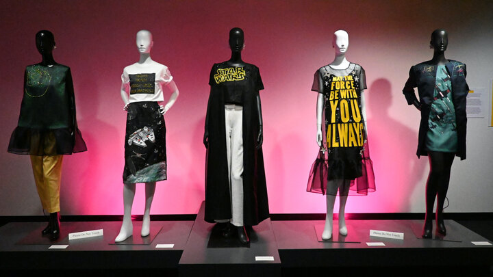 Five mannequin's on display dressed in garments from 