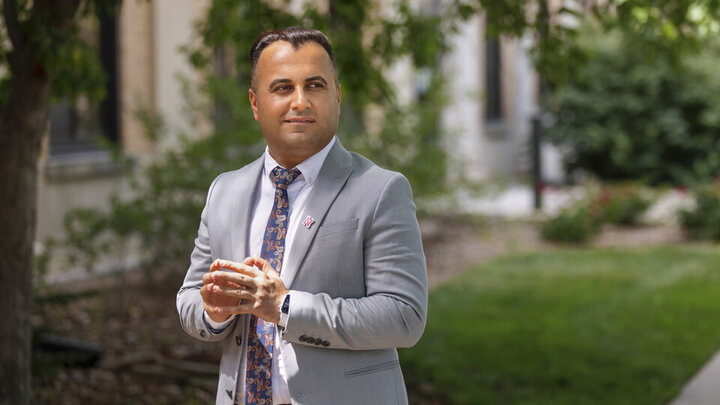 Falah Rashoka stands outside his office on East Campus.