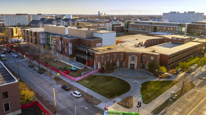 Overhead view of two large buildings, one still under construction.