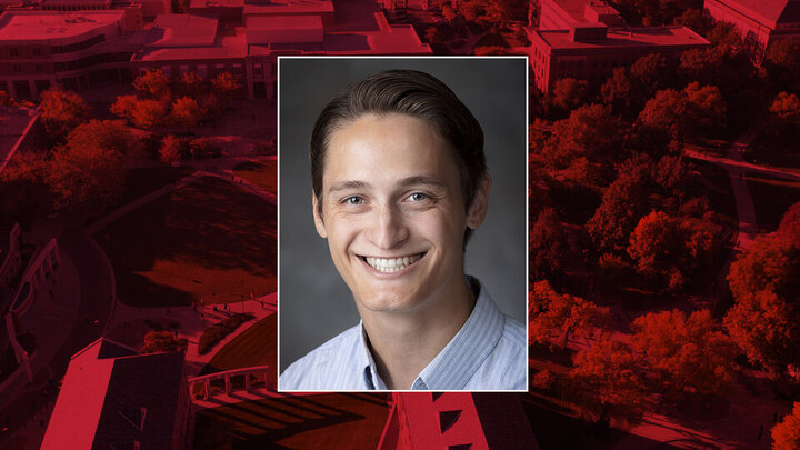 color portrait of Dwight Miller on red campus background