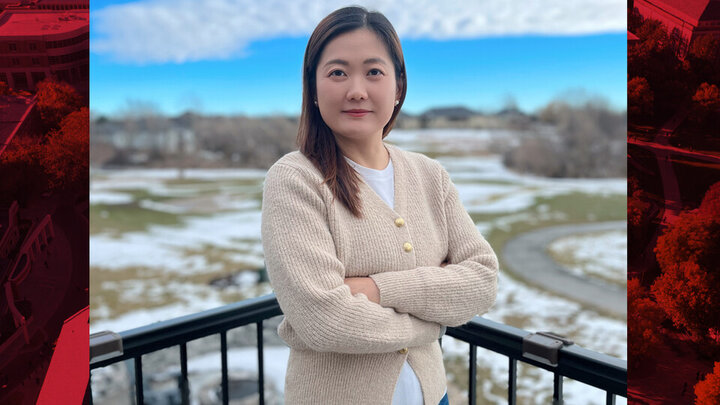 Yao Yao poses for a portrait on a balcony