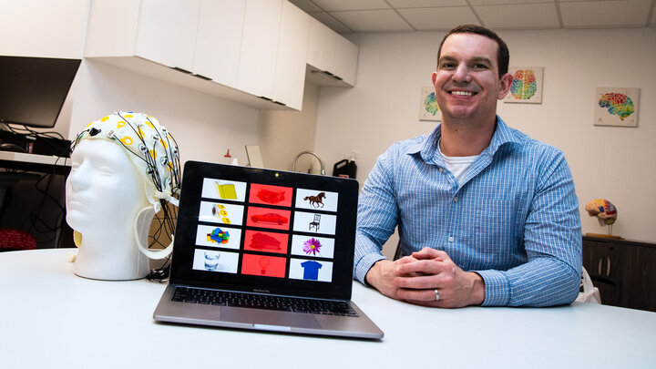 Kevin Pitt, assistant professor of special education and communication disorders, is leading a three-year project that uses brain-computer interface (BCI) technology to facilitate better communication for people with severe speech and physical impairments. (Kyleigh Skaggs, CYFS)