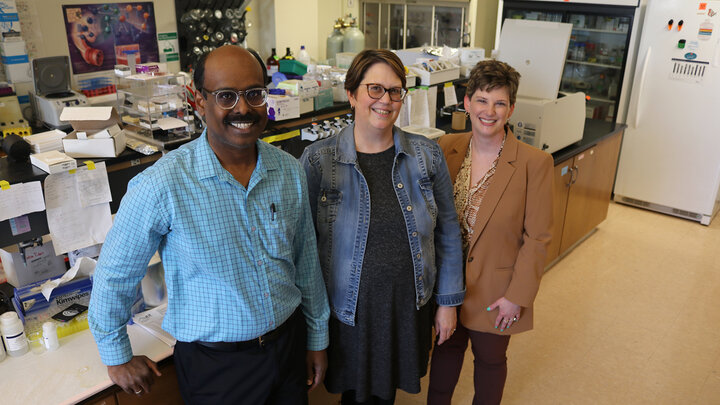 Sathish Kumar Natarajan, Jennifer Wood and Amanda Ramer-Tait pose for a photo in Sathish's research lab