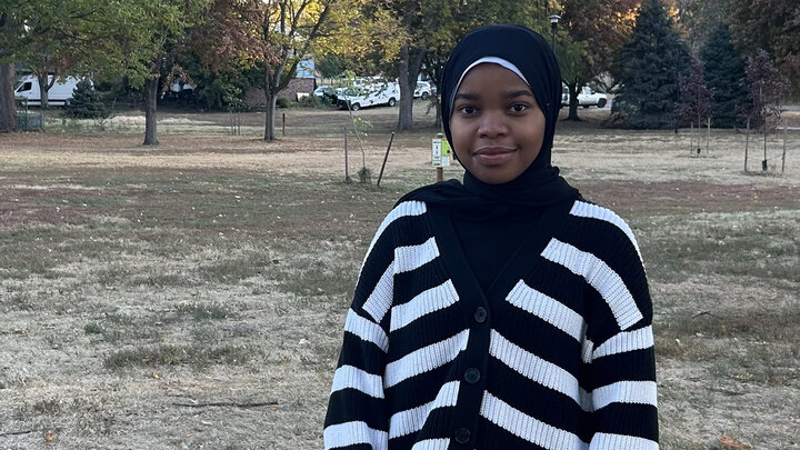 Shereen Ahmed stands for a photo in a park