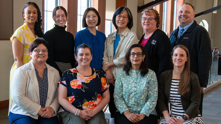 The project’s research team includes, front row, from left: Lisa Poppe, Sarah Paulos, Deepika Menon and Christine Wittich. Back row, from left: Marianna Burks, Maddie Pieper, HyeonJin Yoon, Soo-Young Hong, LaDonna Werth and Doug Golick. (Kyleigh Skaggs, CYFS)