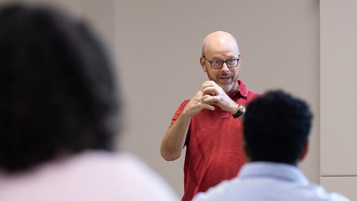 Ted Hamann speaks to a group of graduate students