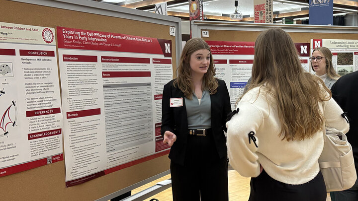 Grace Fowler (left) presents her poster during the undergraduate poster session at Student Research Days in April 2025.