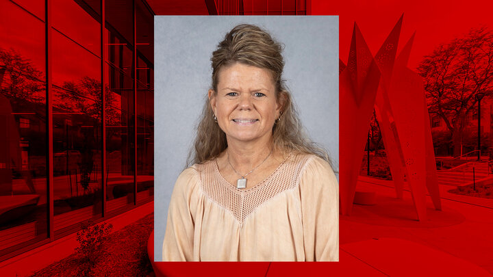 Terri Hogue professional portrait on background image with red overlay