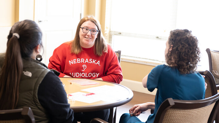 Lauren Paben speaks with a member of the nursing staff at Gateway Vista during a training session in November. (Loren Rye, Pixel Lab)