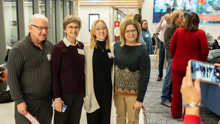 Alena Bennett (second from right) poses for a photo with John and Mary Lynn Bennett, and lecturer Cindy Linzell.