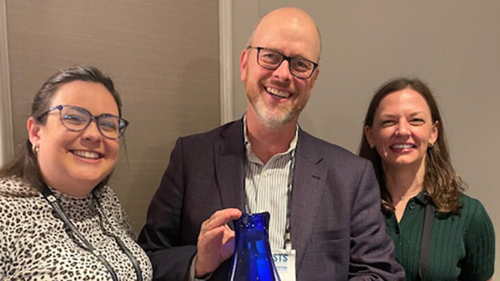 Jessica Sierk, Ted Hamann and Jennifer Stacy photo with Ted holding his George and Louise Spindler Award