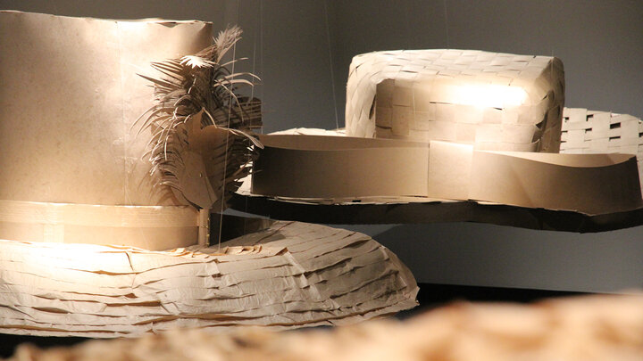 giant hats hanging in the Robert Hillestad Textiles Gallery