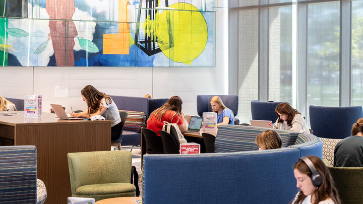 students study in the living room at Carolyn Pope Edwards Hall
