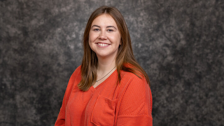 Skyler Reagle portrait photo with gray marbled background