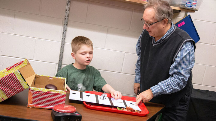 An instructor works with a young student at the Nebraska Center for the Education of Children who are Blind or Visually Impaired in Nebraska City. (Kyleigh Skaggs, CYFS)