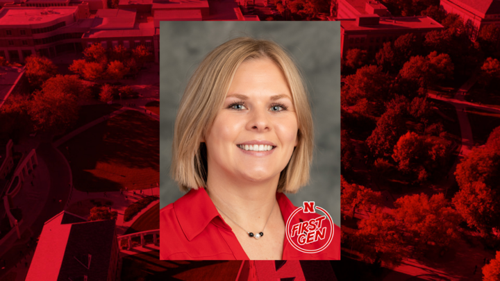 Professional headshot on red background. 