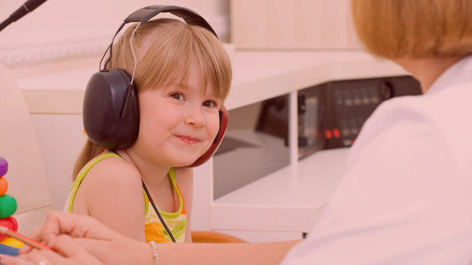 Child wearing headphones.