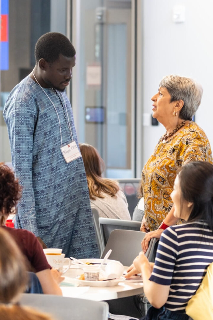 Two people talking at conference