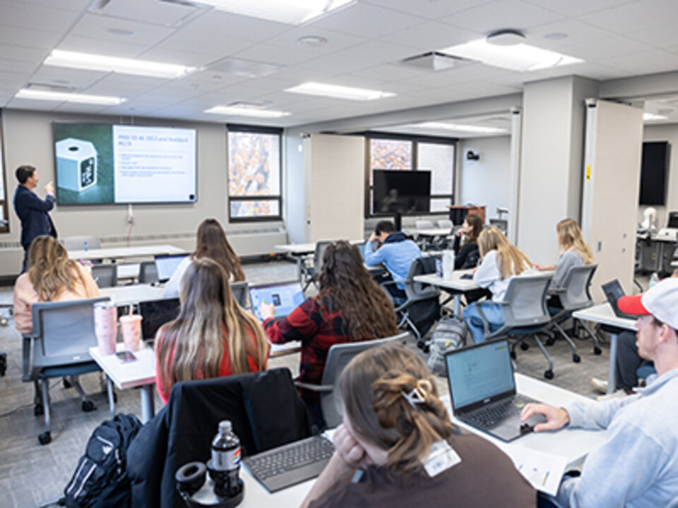 audiology students listen to a lecture by a faculty member