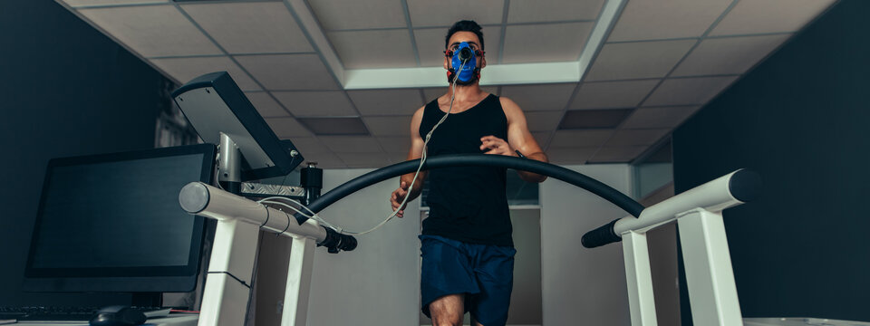 Man running on treadmill in lab.