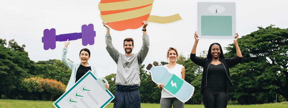 Four people holding health related giant props.