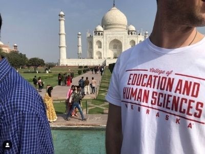 Photo of man in college shirt in india.