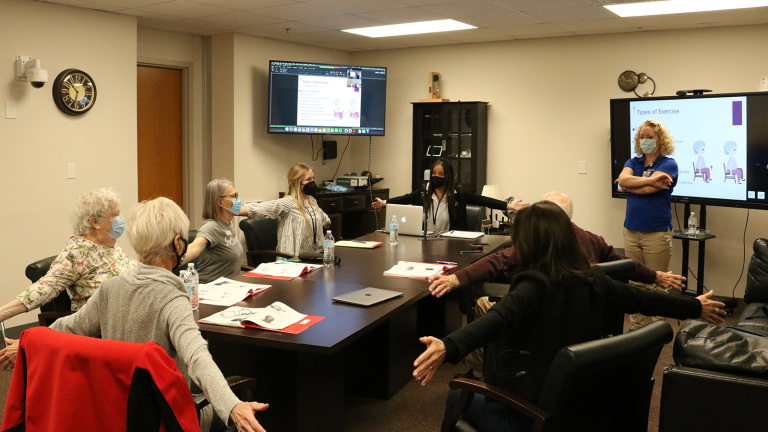 Participants learn about the importance of exercise during a session of the UNL-Tabitha Memory Workshop in March 2022