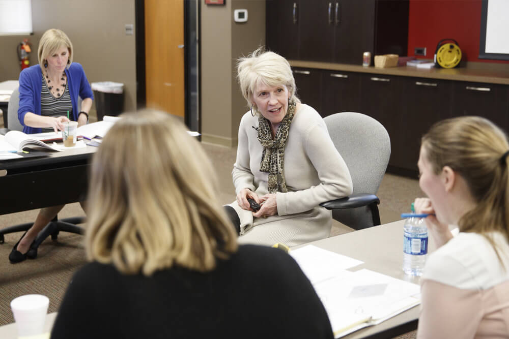 Mary Beth Lehmanowsky in classroom with students